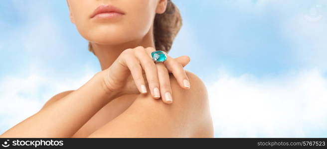 wedding, bridal jewelry and luxury concept - close up of beautiful woman hand with big blue cocktail ring