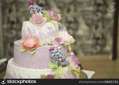 Wedding cake and colorful flowers.. Unusual wedding cake in three tiers 2212.