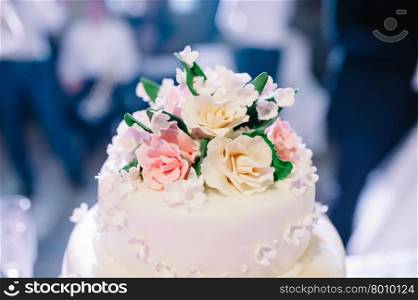 wedding cake decorated with roses