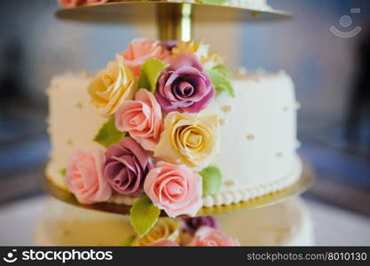 wedding cake decorated with roses