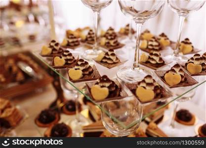 Wedding candy bar with a lot of different desserts. Selective focus. Wedding candy bar with a lot of different desserts. Selective focus.