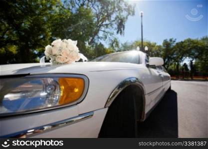 Wedding car decorated with bouquet