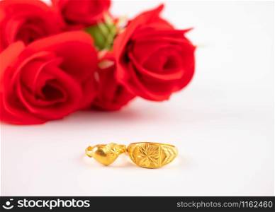 Wedding celebration on valentines day with red rose bouquet, wedding rings, isolated on white background. Concept of love and romance.
