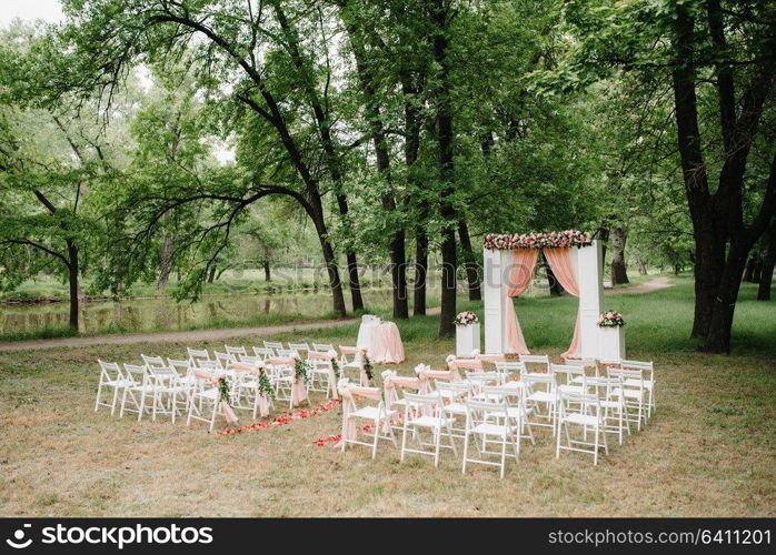 wedding ceremony area, arch chairs decor