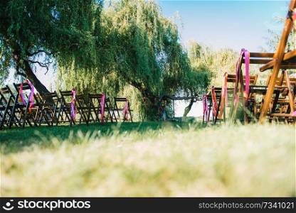 wedding ceremony area, arch chairs decor with trees