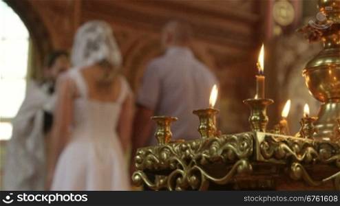 Wedding Ceremony in Russian Christian Orthodox Church Priest blesses the Newlyweds