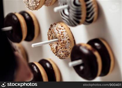 wedding chocolate donuts for guests. festive concept. sweets on a wedding day.. wedding chocolate donuts for guests. festive concept. sweets on a wedding day. wedding donuts