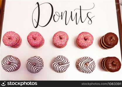 wedding chocolate donuts for guests. festive concept. sweets on a wedding day. wedding donuts. A yummy donut wall. wedding chocolate donuts for guests. festive concept. sweets on a wedding day. wedding donuts. A yummy donut wall.