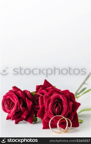 Wedding concept with rings and roses