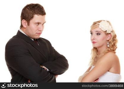Wedding couple conflict, bad relationships. Woman bride and man groom crossed arms looking at each other with angry expression. Isolated on white