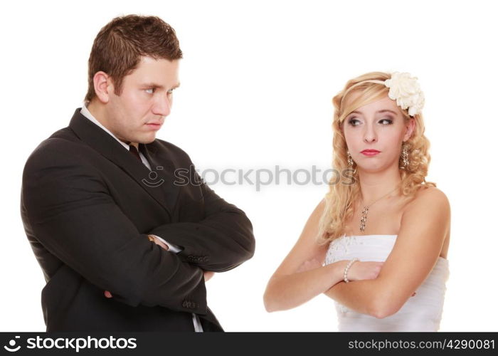 Wedding couple conflict, bad relationships. Woman bride and man groom crossed arms looking at each other with angry expression. Isolated on white