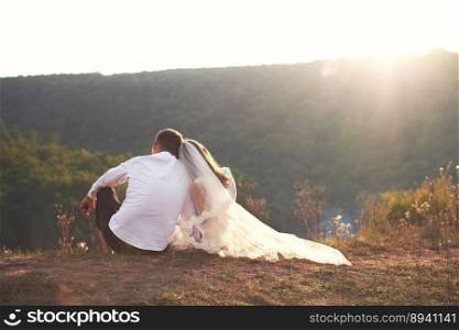 wedding couple in love sitting together and enjoying the view