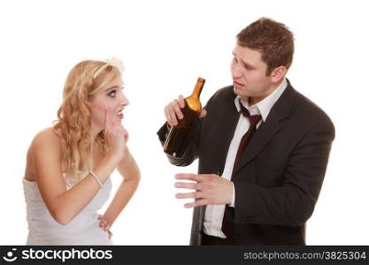 Wedding couple, unhappy bride with alcoholic drinking groom. Woman looking her future - violence alcoholism problems concept