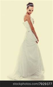 Wedding day. Full length young attractive romantic bride in white gown instagram filter