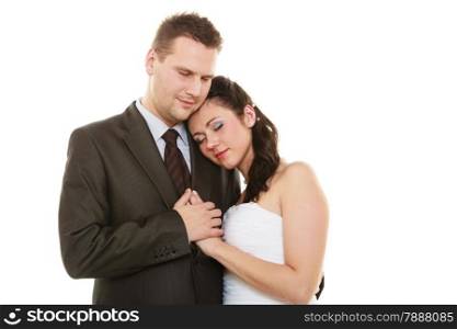 Wedding day. Love and affection. Portrait of hugging bride woman girl in white dress and groom man in elegant suit. Married couple isolated on white.