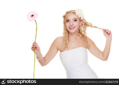 Wedding day. Portrait of happy blonde woman young attractive bride in formal white gown with pink flower gerbera daisy isolated. Studio shot.