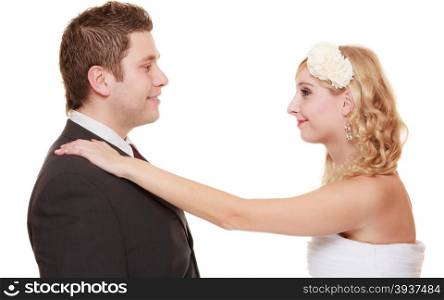 Wedding day. Portrait of happy bride and groom couple isolated on white. Man expressing his tender feelings.