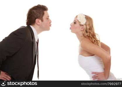 Wedding day. Portrait of happy bride and groom couple kissing isolated on white. Man expressing his tender feelings.