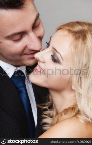 Wedding day. Romantic couple of lovers groom and bride. Studio shot gray background