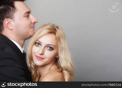 Wedding day. Romantic couple of lovers groom and bride. Studio shot gray background