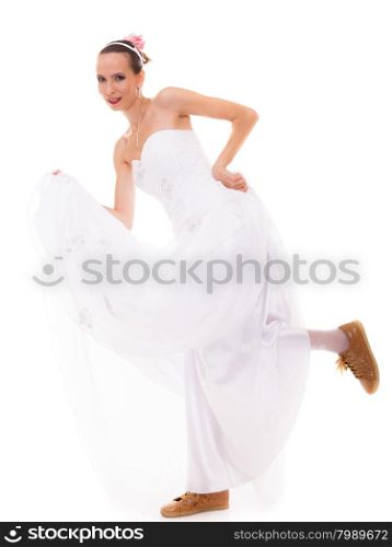 Wedding day. Running bride funny young woman wearing sport shoes isolated on white background