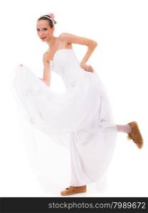 Wedding day. Running bride funny young woman wearing sport shoes isolated on white background