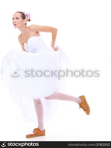 Wedding day. Running bride funny young woman wearing sporting shoes isolated on white background
