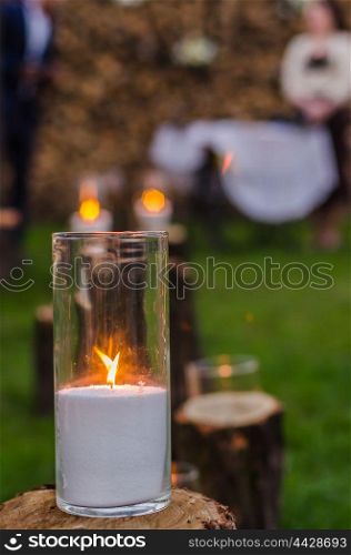 wedding decor, candles on the cut stumps