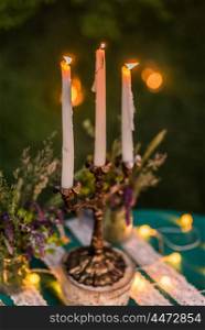 wedding decor, candles on the table, light bulbs, emerald green color