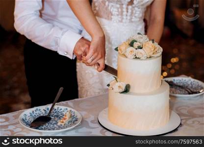 wedding decor with cake on a wooden bench against a waterfall background