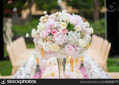Wedding decoration with flowers on a table. Wedding decoration with flowers on a table outdoors