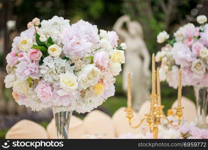 Wedding decoration with flowers on a table. Wedding decoration with flowers on a table outdoors