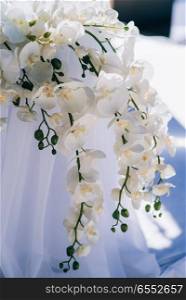 wedding decorations from flowers and a wedding arch for the ceremony