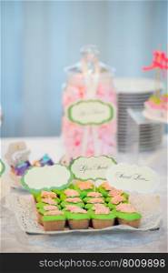 wedding dessert with delicious cakes and macaroons