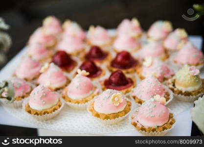 wedding dessert with delicious cakes and macaroons