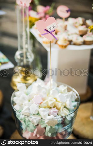 wedding dessert with delicious cakes and macaroons