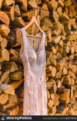 wedding dress on the tree on wood background