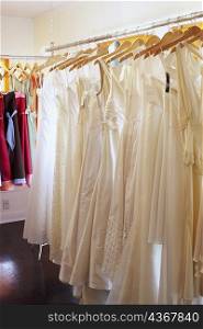 Wedding dresses hanging on a rack