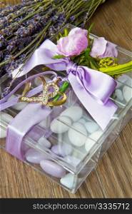 wedding favor with lavender flowers on wooden table