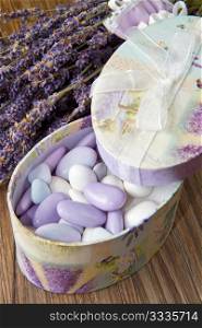 wedding favor with lavender flowers on wooden table