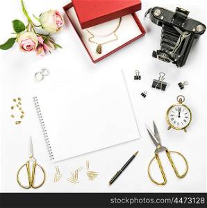 Wedding flat lay background with gift box, golden rings and flowers