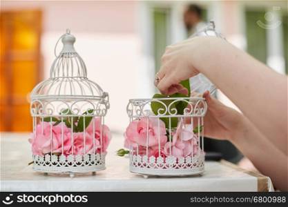 Wedding floral decoration in beautiful vintage birdcage. Wedding decor idea