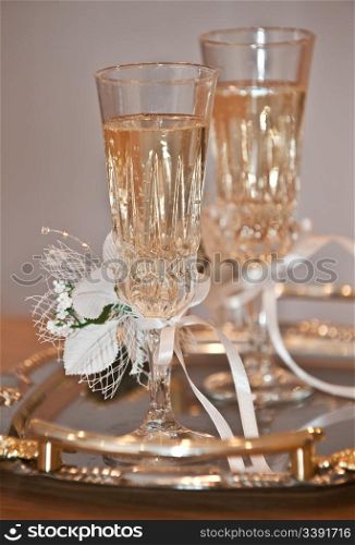 Wedding glasses. Glasses with a champagne decorated decorative flower