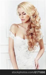 Wedding hairstyle. Portrait of the bride. Long blonde hair, the curls.
