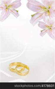 wedding invitation or greeting card blank with lily flowers and golden rings
