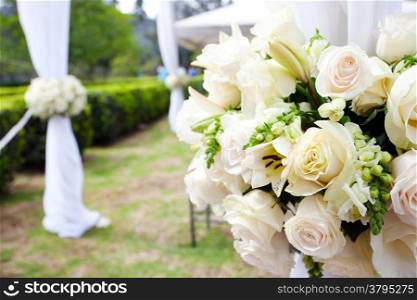 wedding marquee with bouquets of roses