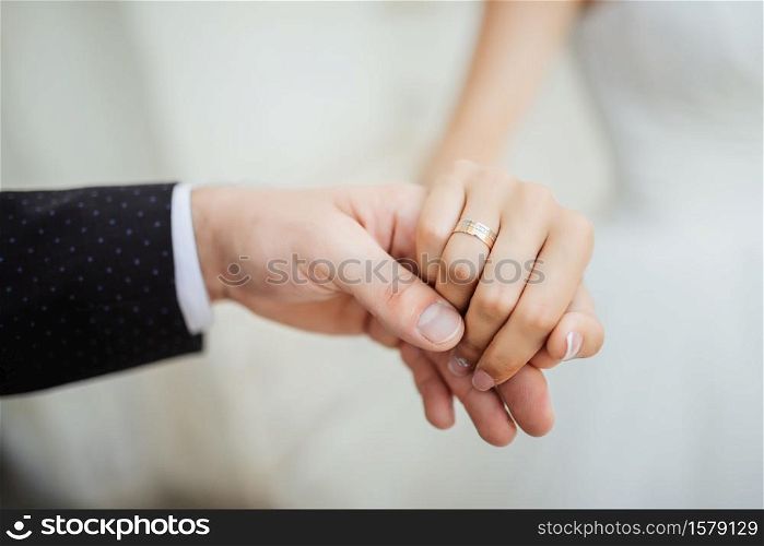 Wedding moments. Newly wed couple&rsquo;s hands with wedding rings