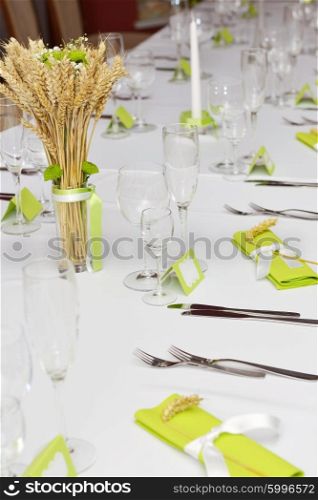 Wedding reception place ready for guests. Detail of wedding dinner setting