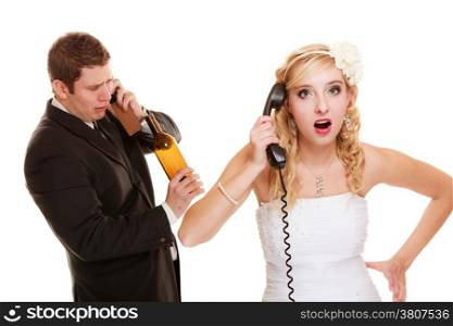 Wedding relationship difficulties. Angry woman and drunk man talking on the phone. Couple bride and groom quarrelling isolated on white. Addiction and alcoholism.