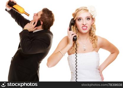 Wedding relationship difficulties. Angry woman and drunk man talking on the phone. Couple bride and groom quarelling isolated on white. Addiction and alcoholism.